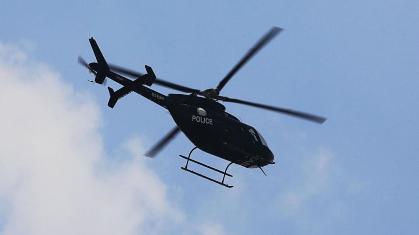 police_on_helicopter.jpeg