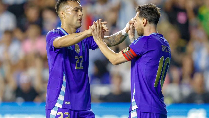 Argentina's forward #10 Lionel Messi and Argentina's forward #22 Lautaro Martinez celebrate
